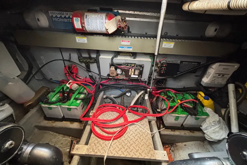 Slide: The Image of Engine compartment of a 2001 Sea Ray 340 Amberjack with batteries and wiring. - 16