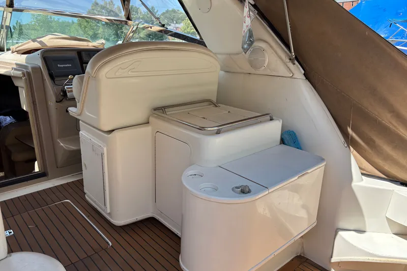 Slide: The Image of 2001 Sea Ray 340 Amberjack boat interior with helm and seating area. - 4