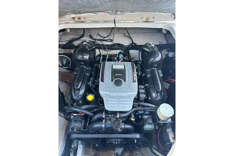 Slide: The Image of Engine compartment of a 2014 Rinker 260 Express Cruiser with MerCruiser engine. - 25