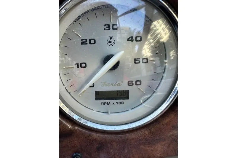 Slide: The Image of Close-up of a 2014 Rinker 260 Express Cruiser tachometer showing RPM. - 24