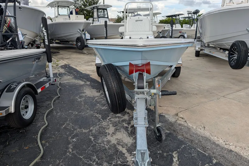 Slide: The Image of 2027 Hewes Redfisher 18 boat on trailer in dealership lot. - 1