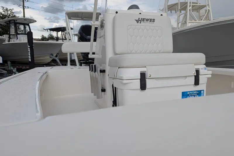 Slide: The Image of 2027 Hewes Redfisher 18 boat interior with cushioned seating and Engel cooler. - 25