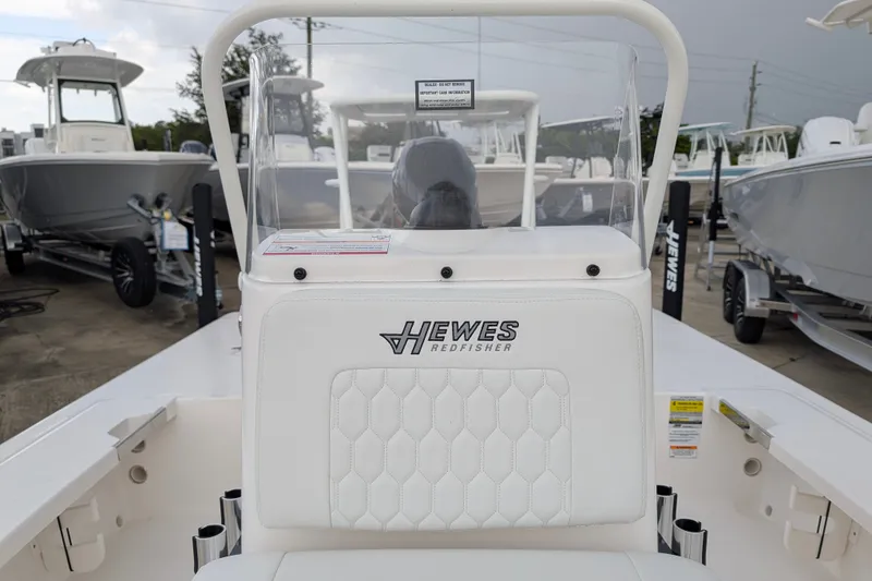 Slide: The Image of 2027 Hewes Redfisher 18 boat interior with branded seating and console. - 15