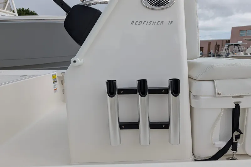Slide: The Image of 2027 Hewes Redfisher 18 boat interior with rod holders and seating. - 24