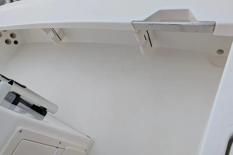 Slide: The Image of Interior view of a 2027 Hewes Redfisher 18 boat, showcasing storage compartments. - 13