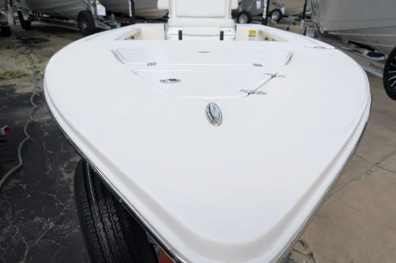 Slide: The Image of 2027 Hewes Redfisher 18 boat deck, showcasing sleek design and storage compartments. - 27