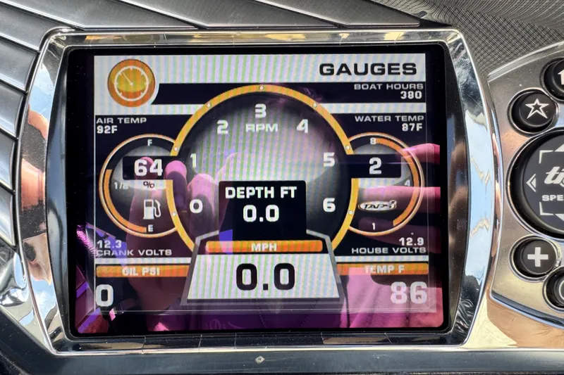 Slide: The Image of Dashboard of a 2014 Tigé Z1 boat showing gauges and temperature readings. - 13