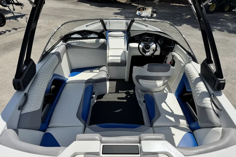 Slide: The Image of 2014 Tigé Z1 boat interior with modern seating and steering wheel. - 10