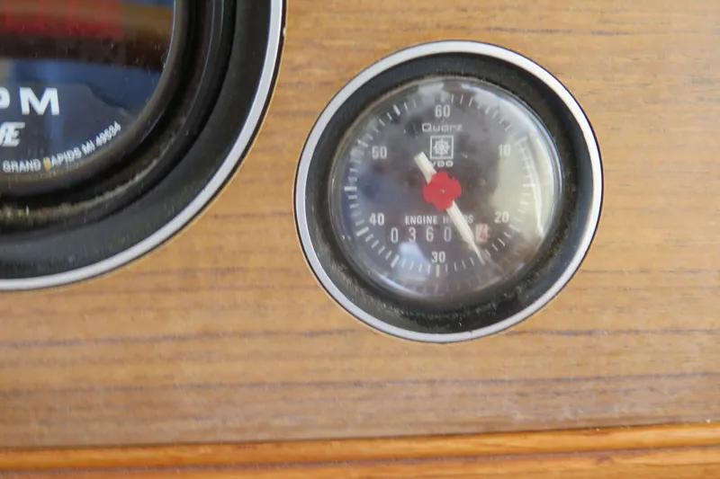 Slide: The Image of Engine hour meter on 1988 Grand Banks 36 Classic boat dashboard. - 19