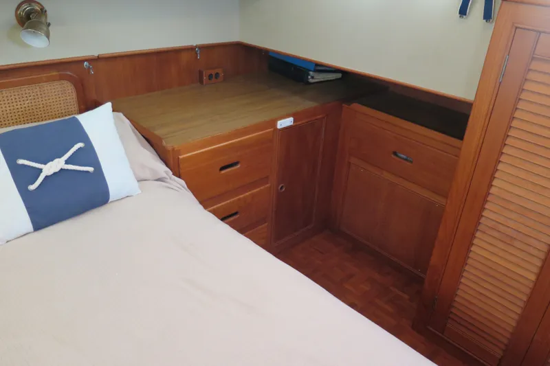 Slide: The Image of Cozy cabin interior of 1988 Grand Banks 36 Classic with wooden cabinetry and nautical decor. - 28