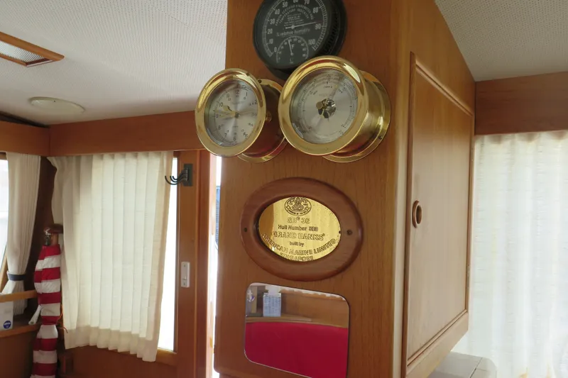 Slide: The Image of Interior of 1988 Grand Banks 36 Classic yacht with brass instruments and plaque. - 23