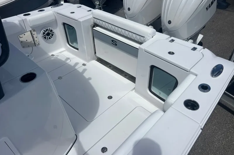 Slide: The Image of 2027 Sportsman Open 282 Center Console boat interior with seating and storage compartments. - 18