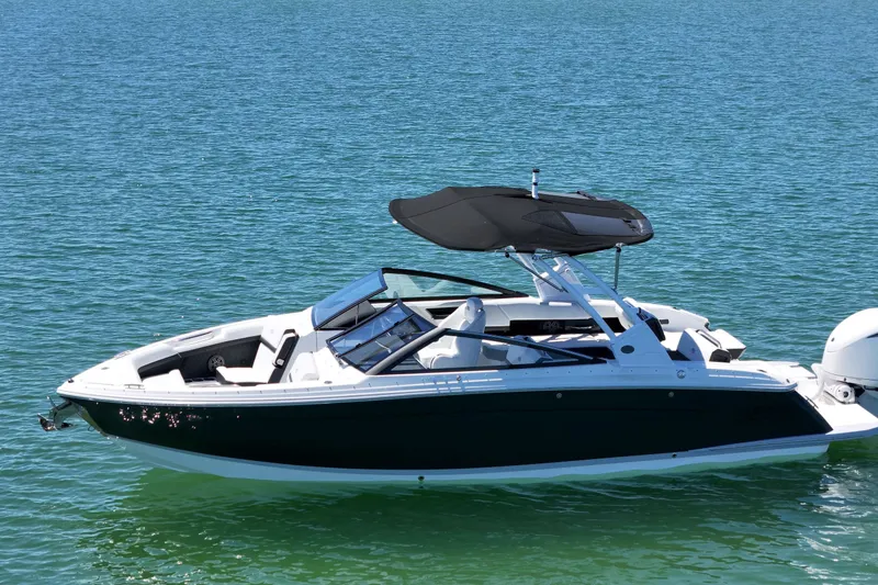 Slide: The Image of 2027 Cobalt R6 Outboard boat on clear blue water, featuring sleek design and modern amenities. - 4