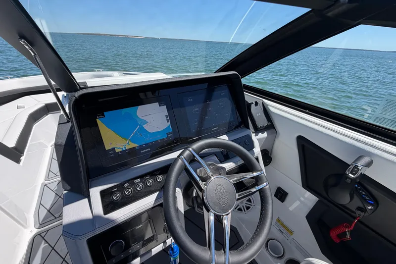 Slide: The Image of Cockpit view of 2027 Cobalt R6 Outboard boat with advanced navigation system. - 14