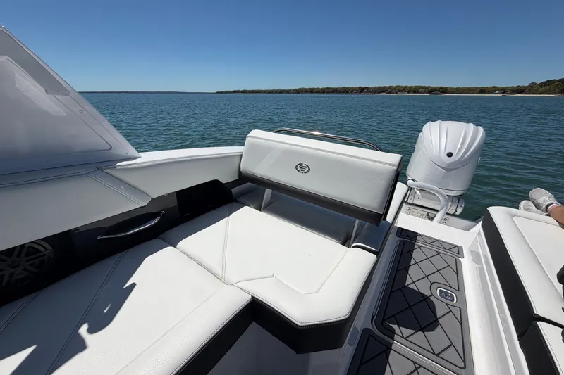 Slide: The Image of Luxurious 2027 Cobalt R6 Outboard boat interior on a serene lake. - 10