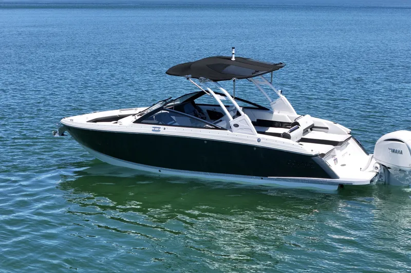 Slide: The Image of 2027 Cobalt R6 Outboard boat with Yamaha engine on calm blue water. - 6