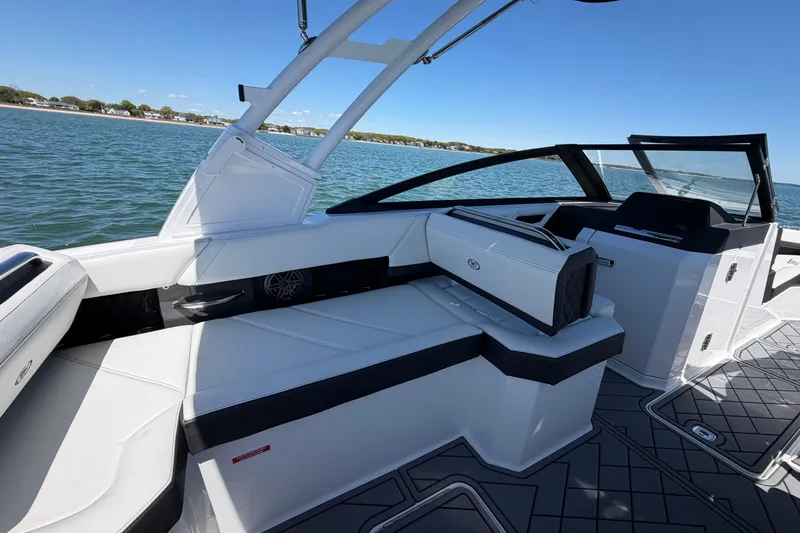 Slide: The Image of 2027 Cobalt R6 Outboard boat interior with sleek seating and modern design on open water. - 12