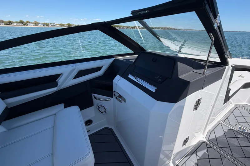 Slide: The Image of Interior view of 2027 Cobalt R6 Outboard boat with sleek seating and modern dashboard. - 17