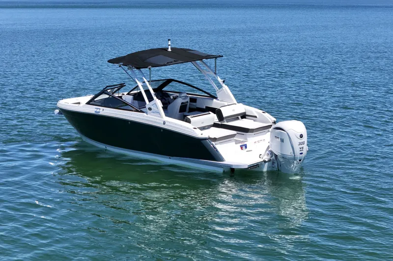 Slide: The Image of 2027 Cobalt R6 Outboard boat on calm blue water, featuring sleek design and powerful engine. - 7