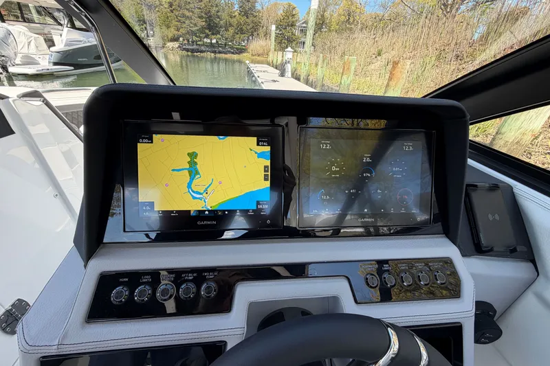 Slide: The Image of Dashboard of 2027 Cobalt R6 Outboard with Garmin navigation displays and controls. - 15