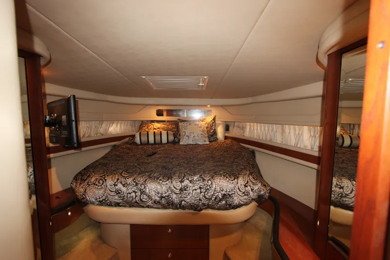 Slide: The Image of Luxurious cabin interior of 2001 Sea Ray Sundancer 460 yacht with elegant bedding. - 17