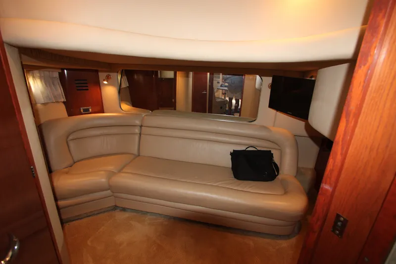 Slide: The Image of Luxurious interior of 2001 Sea Ray Sundancer 460 yacht with beige leather seating. - 13