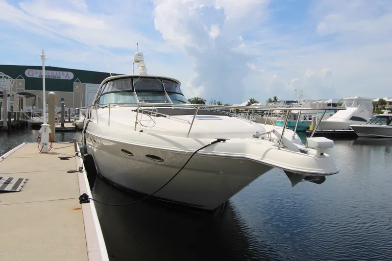 Slide: The Image of 2001 Sea Ray Sundancer 460 yacht docked at marina under clear sky. - 3