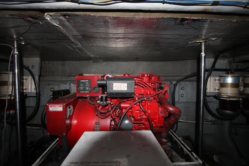 Slide: The Image of Engine room of a 2001 Sea Ray Sundancer 460 with red generator. - 22