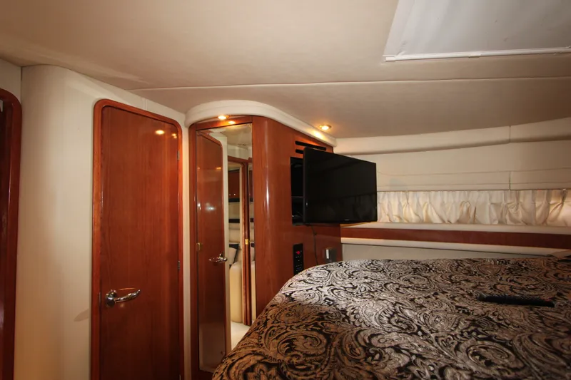 Slide: The Image of Luxurious cabin interior of 2001 Sea Ray Sundancer 460 yacht with elegant wood finishes. - 19