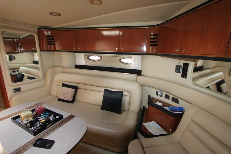 Slide: The Image of Luxurious interior of a 2001 Sea Ray Sundancer 460 yacht with leather seating and wooden cabinetry. - 11