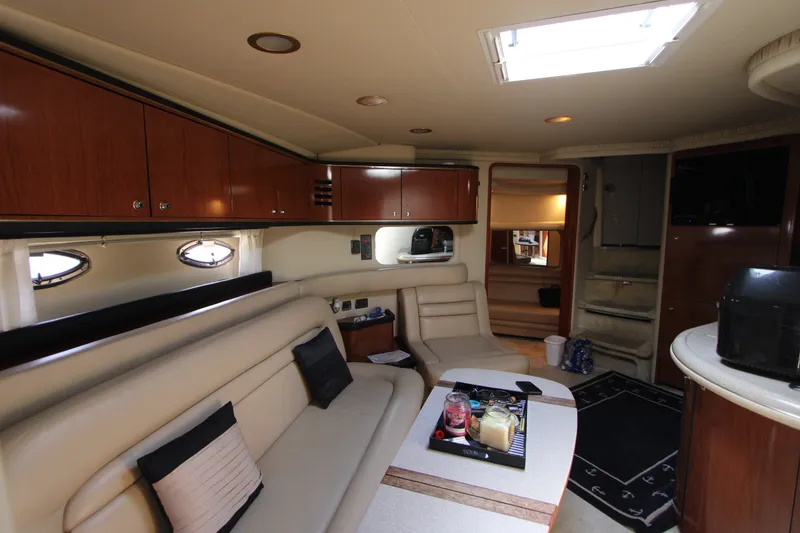 Slide: The Image of Luxurious interior of a 2001 Sea Ray Sundancer 460 yacht with elegant seating and cabinetry. - 16