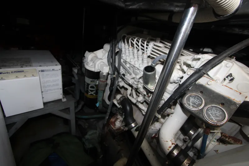 Slide: The Image of Engine compartment of a 2001 Sea Ray Sundancer 460 yacht, showcasing mechanical components. - 24