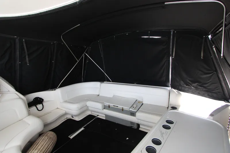 Slide: The Image of 2001 Sea Ray Sundancer 460 interior with white seating and black canopy. - 6