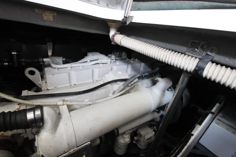 Slide: The Image of Engine compartment of a 2001 Sea Ray Sundancer 460 yacht, showcasing mechanical components. - 23