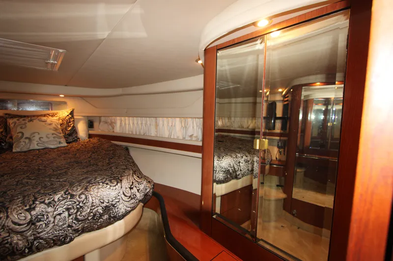 Slide: The Image of Luxurious cabin interior of 2001 Sea Ray Sundancer 460 yacht with elegant bedding. - 18