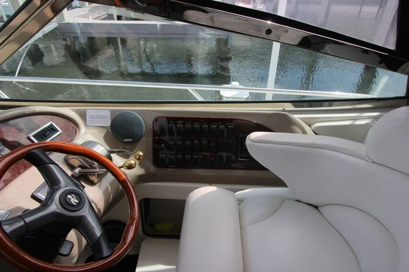 Slide: The Image of Interior helm of 2001 Sea Ray Sundancer 460 yacht with steering wheel and controls. - 10