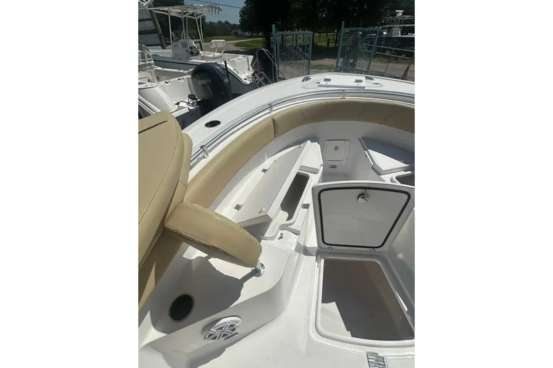 Slide: The Image of 2026 Sportsman Open 232 Center Console boat interior with seating and storage compartments. - 20