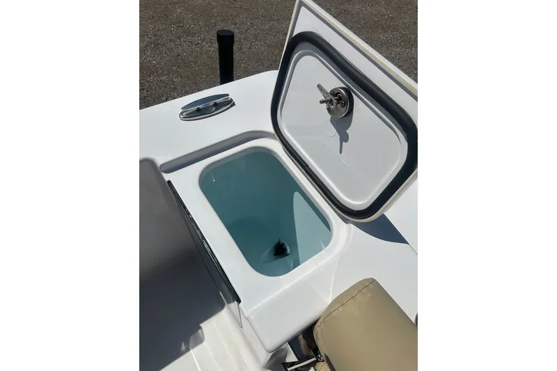 Slide: The Image of Open storage compartment on 2026 Sportsman Open 232 Center Console boat. - 8