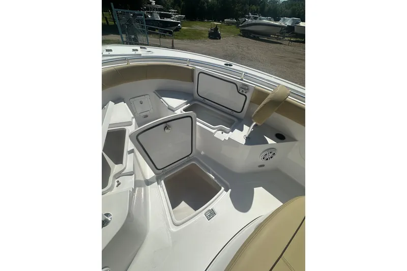Slide: The Image of 2026 Sportsman Open 232 Center Console boat interior with open storage compartments. - 19