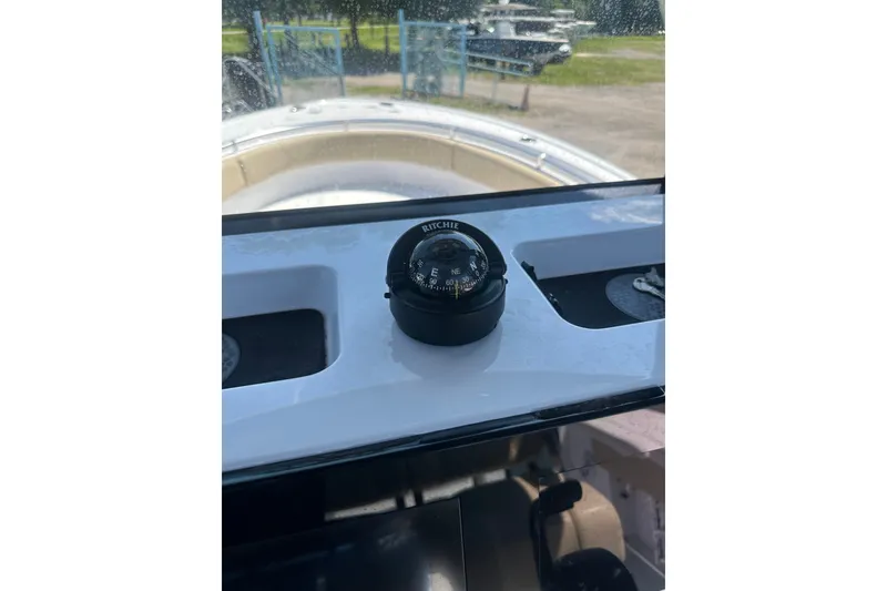 Slide: The Image of Compass on 2026 Sportsman Open 232 Center Console boat dashboard. - 29