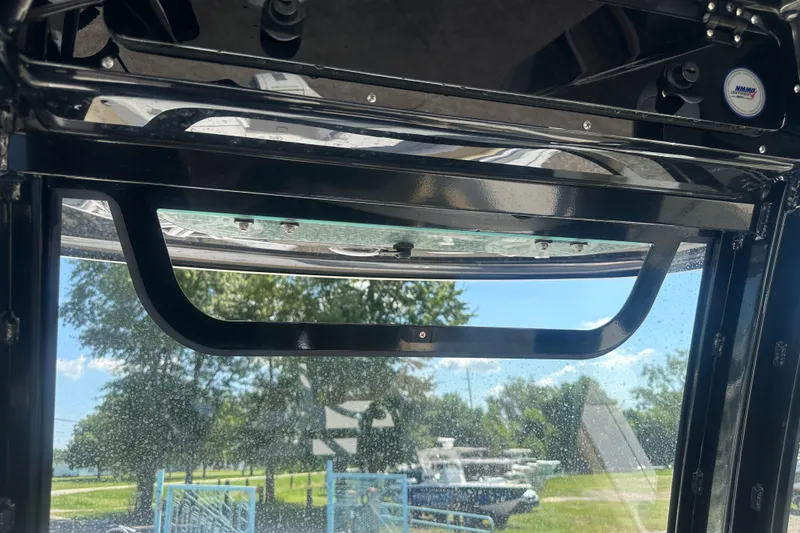 Slide: The Image of Interior view of 2026 Sportsman Open 232 Center Console boat with clear sky background. - 31
