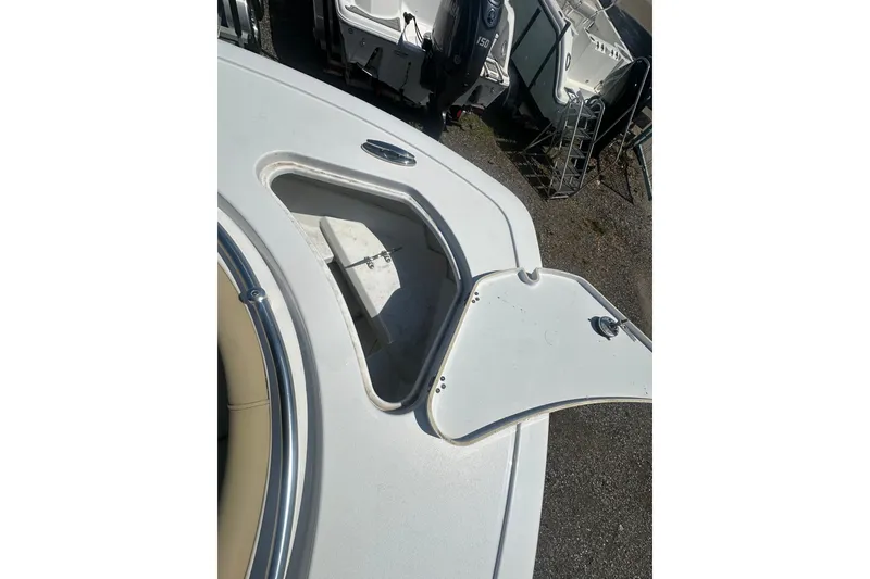 Slide: The Image of 2026 Sportsman Open 232 Center Console boat with open storage compartment. - 26