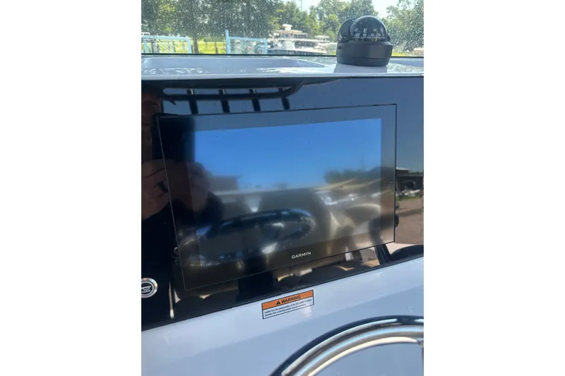 Slide: The Image of Garmin display on 2026 Sportsman Open 232 Center Console boat dashboard. - 27