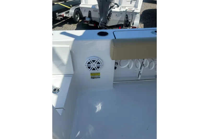 Slide: The Image of 2026 Sportsman Open 232 Center Console boat interior with speaker and seating detail. - 9