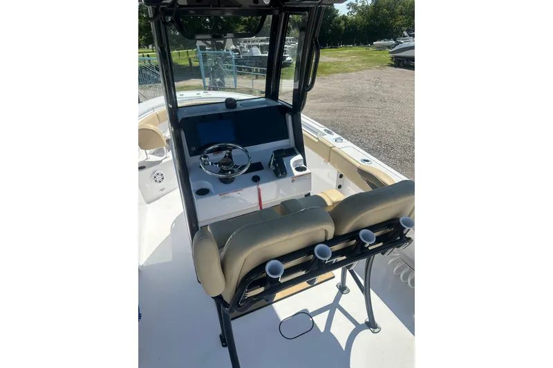 Slide: The Image of 2026 Sportsman Open 232 Center Console boat interior with steering wheel and seating. - 5