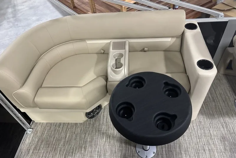 Slide: The Image of Luxurious seating area on 2027 Godfrey XPERIENCE 2086 boat with cup holders and table. - 7