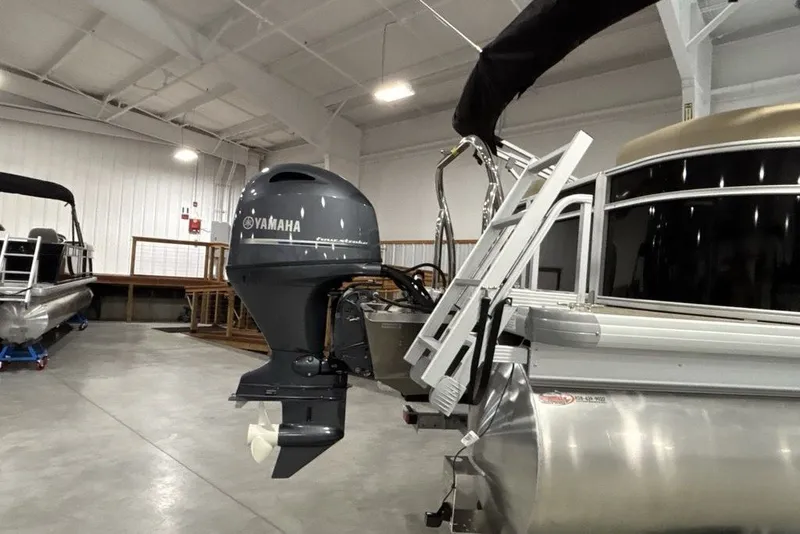 Slide: The Image of 2027 Godfrey XPERIENCE 2086 pontoon boat with Yamaha outboard motor in showroom. - 18