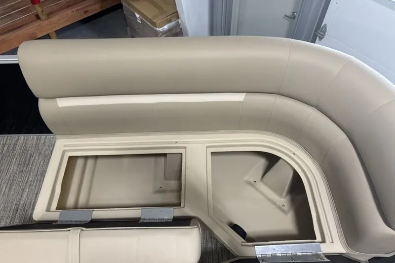 Slide: The Image of Beige seating with storage compartments on a 2027 Godfrey XPERIENCE 2086 boat. - 15