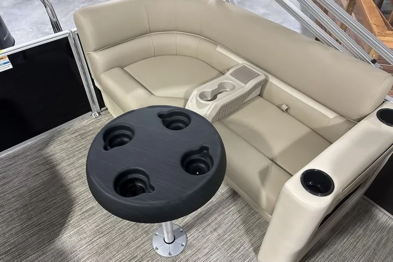 Slide: The Image of Luxurious seating area on 2027 Godfrey XPERIENCE 2086 pontoon boat with cup holders and table. - 11