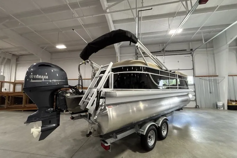 Slide: The Image of 2027 Godfrey XPERIENCE 2086 pontoon boat with Yamaha engine in a spacious indoor setting. - 22